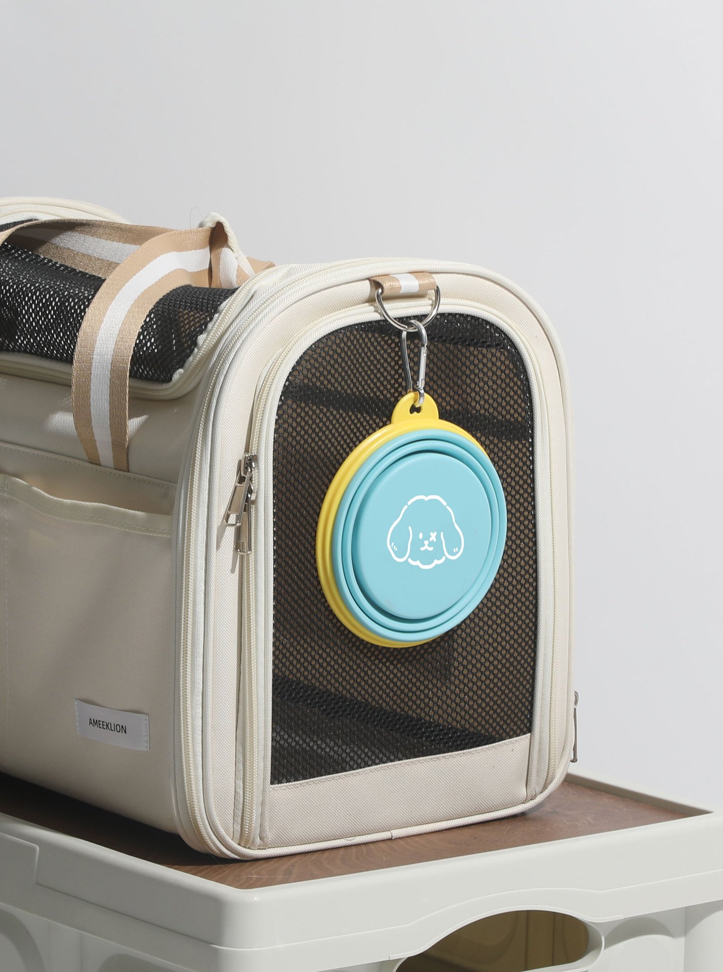 Clips onto any bag, carrier or leash